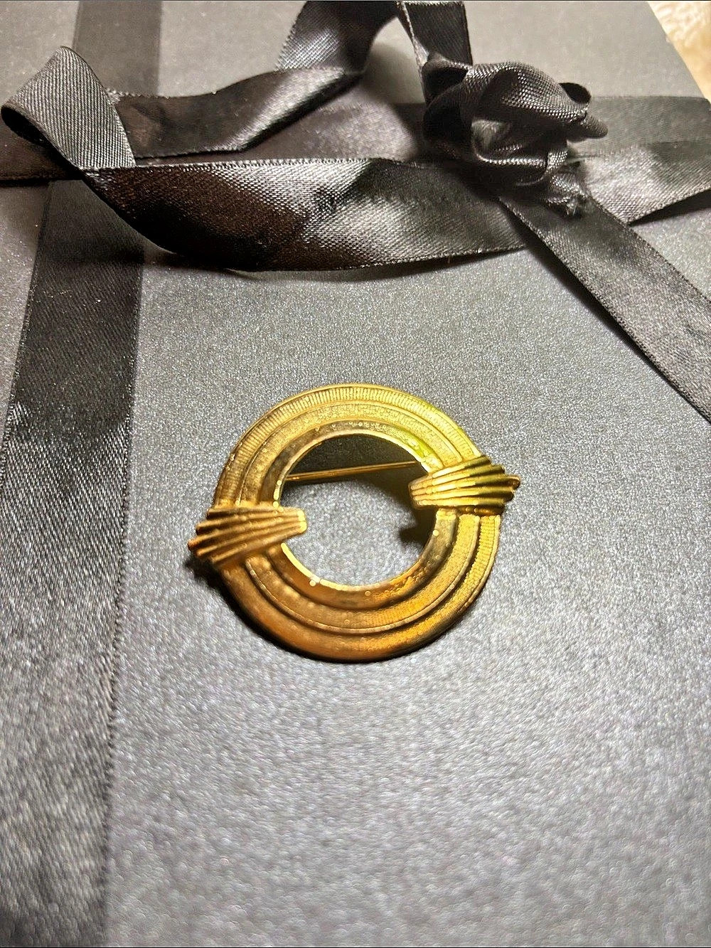 Vintage Gold-Tone Circular Brooch with Black Ribbon